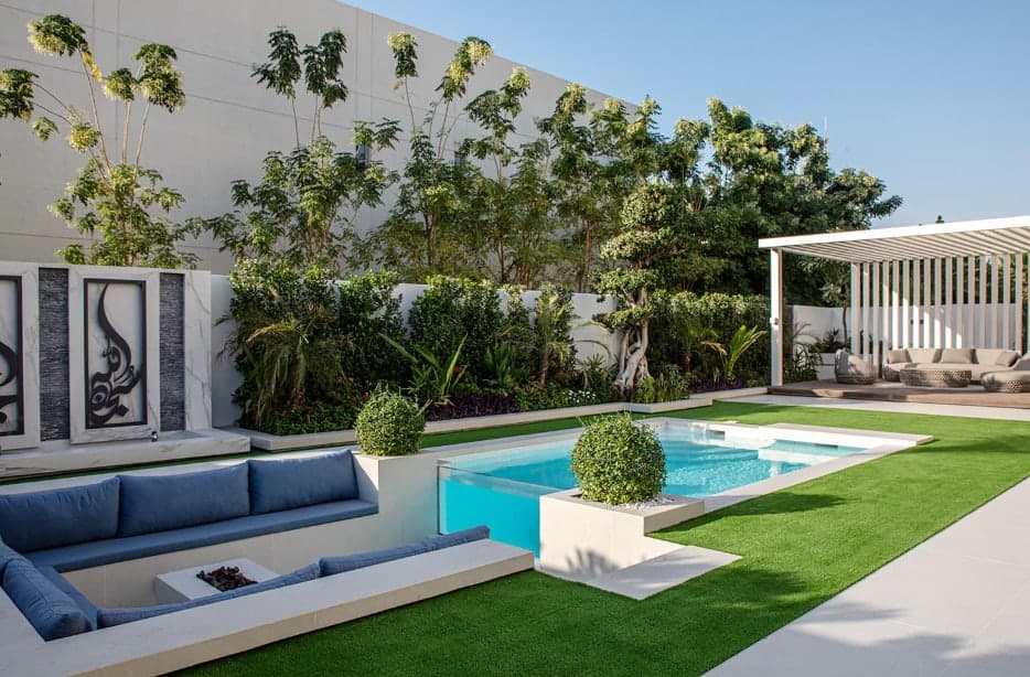 Courtyard pool, pergola, and planted walls